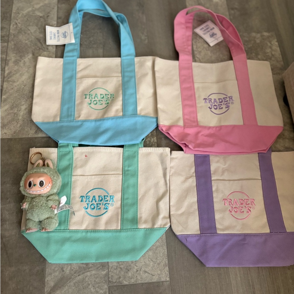 Trader Joe’s canvas tote bags with a labubu macaron in Green Grape
